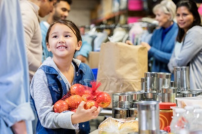 Girl holding a bag of apples at a... </p> 

<p> </p> </div>
<div class=