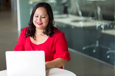 A woman wearing red is working on a... </p> 

<p> </p> </div>
<div class=